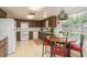 Spacious eat-in kitchen featuring an island and updated appliances at 6019 Wyoming Ave, New Port Richey, FL 34653