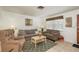 Warm and inviting living room with comfortable seating and natural light at 6019 Wyoming Ave, New Port Richey, FL 34653