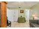 The living room includes a sauna, a table, neutral tile flooring, and bright green walls at 6019 Wyoming Ave, New Port Richey, FL 34653