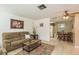 Cozy living room with tile floors leads into dining area at 6019 Wyoming Ave, New Port Richey, FL 34653