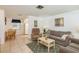 Inviting living room with neutral colors and tile flooring, perfect for entertaining guests at 6019 Wyoming Ave, New Port Richey, FL 34653