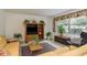 Inviting living room featuring tiled floors, comfortable furniture, and stylish decor at 6019 Wyoming Ave, New Port Richey, FL 34653