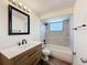 Bathroom featuring updated vanity, bathtub, shower, and window for natural light at 6341 Hyperion Dr, Port Richey, FL 34668