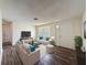 Comfortable living room with stylish furnishings, wood flooring, and ample natural light at 6341 Hyperion Dr, Port Richey, FL 34668