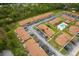 Aerial view displays the community layout, green spaces, and parking areas at 7122 Barclay Ave # B, Spring Hill, FL 34609