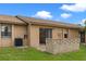 Cozy back patio offers a private outdoor space with access to the lawn at 7122 Barclay Ave # B, Spring Hill, FL 34609