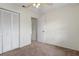 Bedroom featuring carpet, a ceiling fan, closet, and a doorway to another room at 7122 Barclay Ave # B, Spring Hill, FL 34609