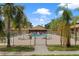 Inviting community pool area featuring seating and lush landscaping at 7122 Barclay Ave # B, Spring Hill, FL 34609