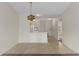 Bright dining area features pendant light and access to kitchen and front door at 7122 Barclay Ave # B, Spring Hill, FL 34609