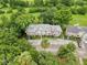 Aerial view of the residential neighborhood with lush trees at 7135 Trenton Pl, New Port Richey, FL 34653