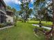 Lush backyard with creek, garden bed, landscaping, and outdoor seating; perfect for relaxation at 7135 Trenton Pl, New Port Richey, FL 34653