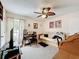 Bedroom area featuring a leaf fan, desk, and futon at 7135 Trenton Pl, New Port Richey, FL 34653