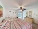 Bright bedroom with two beds, dresser, and sliding glass doors at 7135 Trenton Pl, New Port Richey, FL 34653