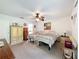 Bright bedroom featuring two beds, ceiling fan, and closet at 7135 Trenton Pl, New Port Richey, FL 34653