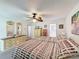 Bright bedroom with two beds, mirrors and leaf fan at 7135 Trenton Pl, New Port Richey, FL 34653
