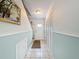 Inviting entryway with tiled floor, coat closet, and staircase at 7135 Trenton Pl, New Port Richey, FL 34653
