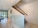 Bright hallway featuring tile floors and wainscotting at 7135 Trenton Pl, New Port Richey, FL 34653