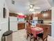 Functional kitchen with ample cabinetry, white appliances, and cozy dining area at 7135 Trenton Pl, New Port Richey, FL 34653