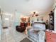 Comfortable living room featuring tile floors and view into the kitchen at 7135 Trenton Pl, New Port Richey, FL 34653