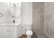 Well-lit bathroom with a modern vanity, tiled shower, and contemporary fixtures at 7192 Catalina St, Spring Hill, FL 34606