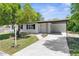 Charming single-story home with a covered carport and inviting front yard landscape at 7192 Catalina St, Spring Hill, FL 34606