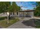 Inviting home exterior with a carport and walkway leading to the entrance at 7192 Catalina St, Spring Hill, FL 34606