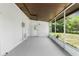 View of screened-in porch with utility access, leading to the home's backyard at 7192 Catalina St, Spring Hill, FL 34606