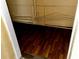 Basement featuring dark hardwood flooring and overhead pipes at 723 W Bayshore Dr, Tarpon Springs, FL 34689