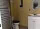 Bathroom featuring vanity with cabinet and toilet next to walk-in shower at 723 W Bayshore Dr, Tarpon Springs, FL 34689