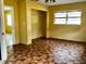 Bedroom featuring tile flooring and window with blinds at 723 W Bayshore Dr, Tarpon Springs, FL 34689