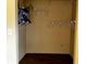 Walk-in closet with shelving and dark hardwood flooring at 723 W Bayshore Dr, Tarpon Springs, FL 34689