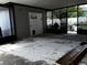 Spacious screened-in patio with open access to the backyard, ready for customization at 723 W Bayshore Dr, Tarpon Springs, FL 34689