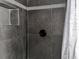 Modern shower with hexagon accent tiling at 723 W Bayshore Dr, Tarpon Springs, FL 34689