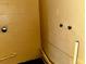 This unfinished utility area features painted walls, and the plumbing for a washing machine at 723 W Bayshore Dr, Tarpon Springs, FL 34689