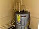 The home's water heater with visible piping at 723 W Bayshore Dr, Tarpon Springs, FL 34689