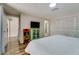 Bedroom featuring a bed, closet, and ensuite bathroom at 7412 Bellows Falls Ln, Hudson, FL 34667