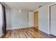 Bedroom with wood floors, closet, and neutral paint at 7412 Bellows Falls Ln, Hudson, FL 34667