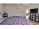 Bedroom featuring a bed and mirrored console at 7412 Bellows Falls Ln, Hudson, FL 34667