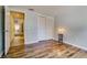 A comfortable bedroom with wood floors and closet at 7412 Bellows Falls Ln, Hudson, FL 34667