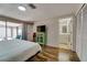 Bedroom with backyard view, closet, and ensuite bathroom at 7412 Bellows Falls Ln, Hudson, FL 34667