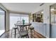 Dining area with hardwood floors and a view into the kitchen at 7412 Bellows Falls Ln, Hudson, FL 34667