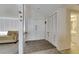 Welcoming home entry with double doors, closet and access to a full bathroom at 7412 Bellows Falls Ln, Hudson, FL 34667