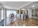 Cozy kitchen and dining area featuring hardwood floors and stainless steel appliances at 7412 Bellows Falls Ln, Hudson, FL 34667