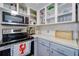Kitchen features stainless steel appliances and ample counter space and storage, with natural light at 7412 Bellows Falls Ln, Hudson, FL 34667