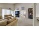 Spacious living room featuring neutral carpet, high ceilings, and lots of natural light at 7412 Bellows Falls Ln, Hudson, FL 34667