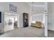 Bright living room with vaulted ceilings, neutral carpet, and an open view to another room at 7412 Bellows Falls Ln, Hudson, FL 34667