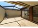 Open patio with partial covering, ideal for outdoor dining and relaxing, complete with views and cozy seating at 7412 Bellows Falls Ln, Hudson, FL 34667
