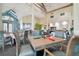 Elegant dining area featuring well-appointed tables and chairs in a bright, open space at 7423 Woodhollow Rd, Spring Hill, FL 34606