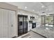 A bright kitchen features stainless steel appliances, granite countertops, and lots of cabinet space for storage at 7423 Woodhollow Rd, Spring Hill, FL 34606