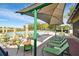 Relaxing poolside area with lounge chairs and shade canopies on a sunny day at 7423 Woodhollow Rd, Spring Hill, FL 34606